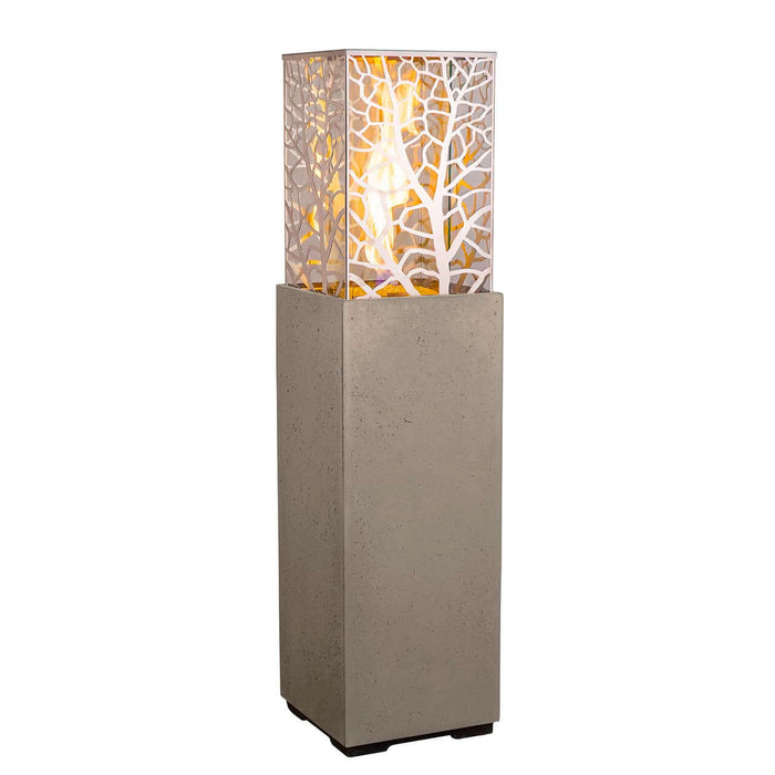Tall floor lamp with a decorative glass shade on a white background