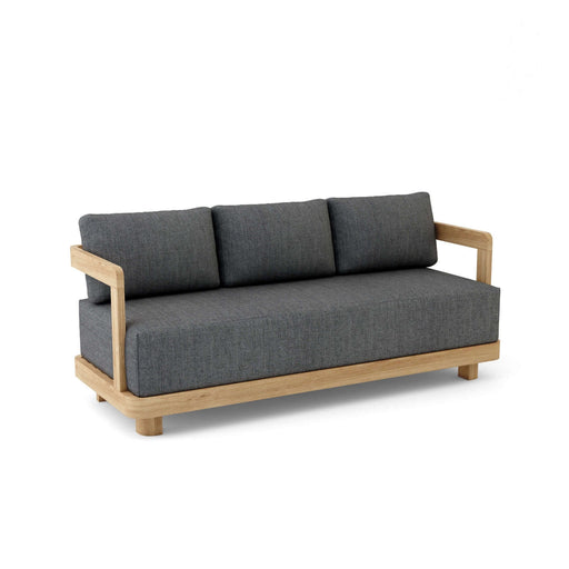 A modern Granada Deep Seating Sofa with a teak wood frame and gray cushions made of All-Weather Sunbrella Fabrics.