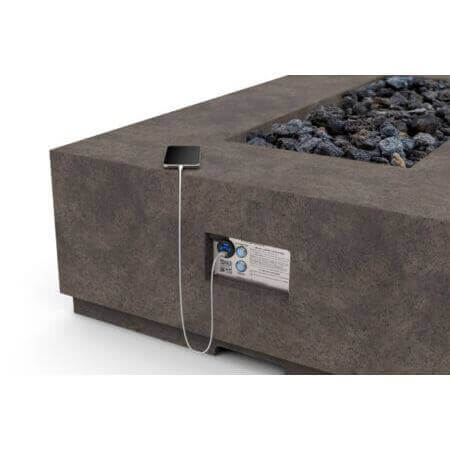 Concrete fire pit table with electronic control panel on a white background